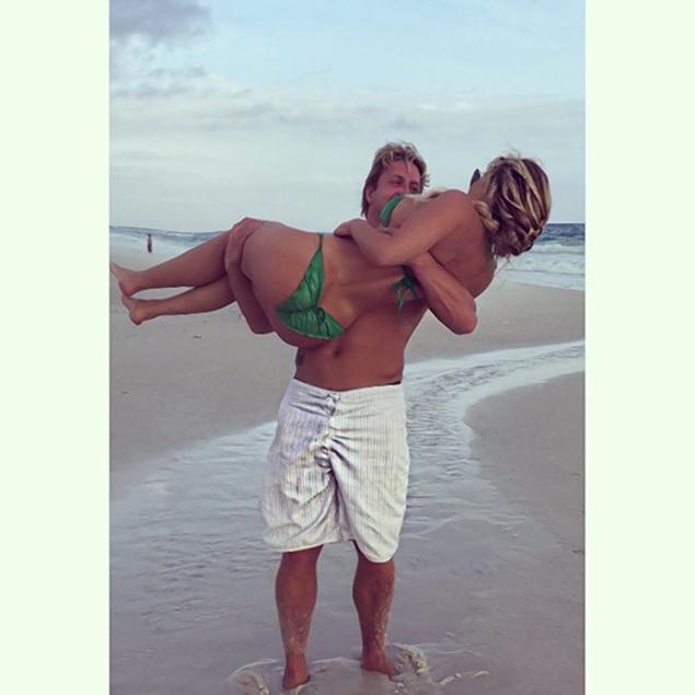 Despite the haters who recently body shamed Kim Zolciak online, the reality star is not embarassed showing off her body after six children. "He loves me just the way I am," she captioned this pic of husband Kroy Biermann carrying her.