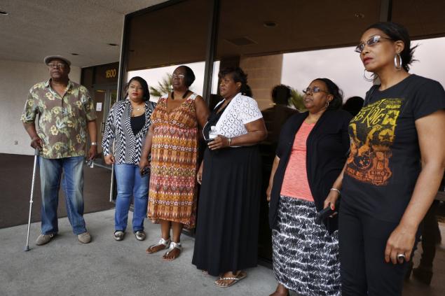 Willie King, from left, Tanya Deckard, Patty King, Karen Williams, Barbara King Winfree and Rita Washington stand outside of a funeral home after a private family viewing of blues musician B.B. King last week.