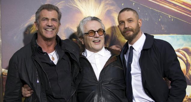 Mel Gibson (l.) surprised director George Miller (c.) and Tom Hardy at the premiere of "Mad Max: Fury Road" in Los Angeles on Thursday.  