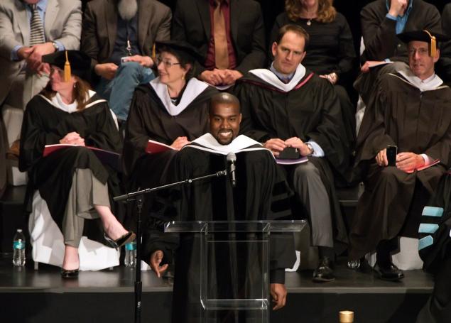 Kanye West takes the mic after receiving his honorary doctorate in Chicago Sunday.