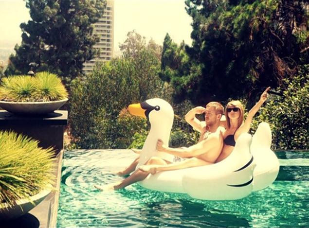 Taylor Swift shared a photo on her Instagram of herself with Calvin Harris in a blowup swan floatie, captioned ‘Swan goals.’
