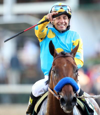 Jockey Victor Espinoza and American Pharoah after winning  the Kentucky Derby on May 2, 2015. He says the whip doesn’t hurt the horse.