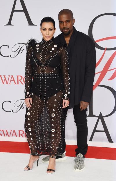 Kim Kardashian and husband Kanye West attend the 2015 CFDA Fashion Awards in June.