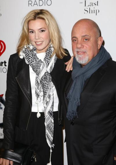 Billy Joel (right) married his 33-year-old pregnant girlfriend, Alexis Roderick (left), during the couple’s annual Independence Day party