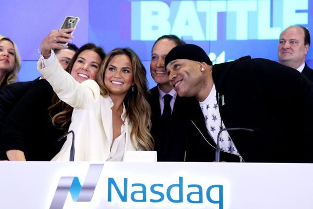 Chrissy Teigen and LL Cool J (front) got together at NASDAQ’s opening bell for the series “Lip Sync Battle.”