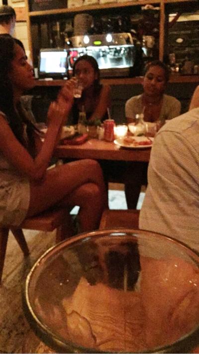 Malia (left) and Sasha Obama (center) at Ruby's Cafe, where they had dinner Saturday with eight friends.