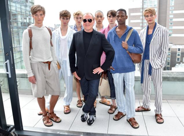 Designer Michael Kors, center, and models from his spring collection show during Fashion Week.