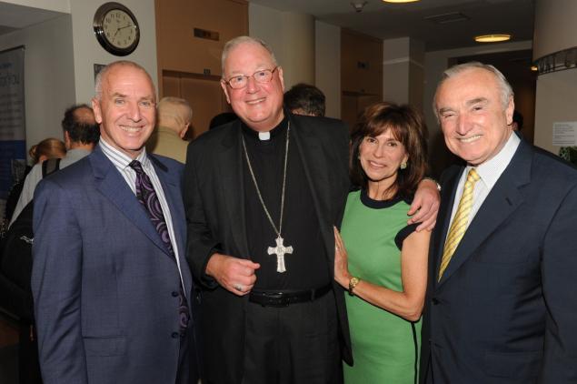 From left, Arthur Browne, Timothy Cardinal Dolan, attorney and television host Rikki Klieman and her husband, Police Comissioner Bill Bratton, at the Schomburg Center event for Browne’s new book, “One Righteous Man.”