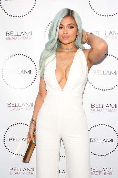 Kylie Jenner in all-white on the red carpet at Bellami Beauty Bar in West Hollywood.