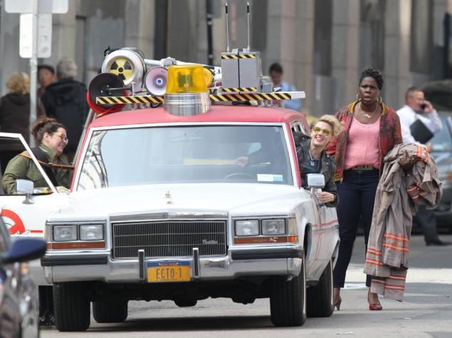 (From left) Melissa McCarthy, Kate McKinnon (in driver's seat) and Leslie Jones on set of "Ghostbusters" in Boston.