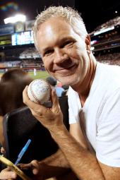 Actor Gerald McCullouch holding a baseball he autographed at Citi Field last Thursday.
