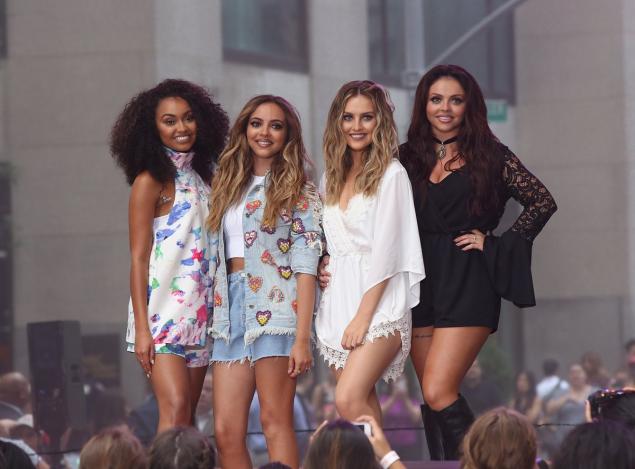 Perrie Edwards (second from r.) and Little Mix performed at Rockfeller Plaza on Wednesday.