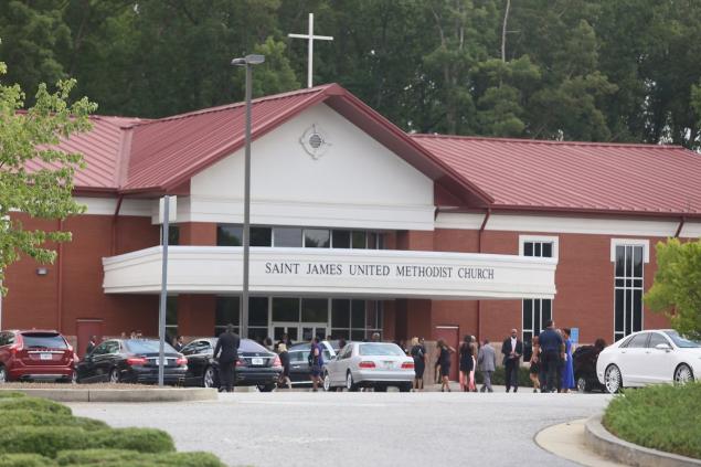 Guests arrive at the funeral of Bobbi Kristina Brown at the St. James United Methodist Church in Alpharetta, Georgia.