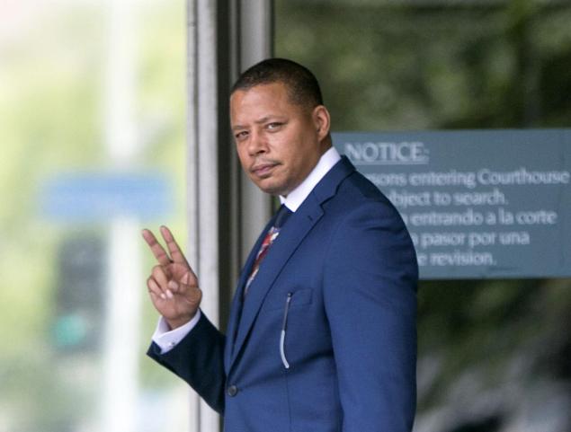 Actor Terrence Howard walks into a Los Angeles court for a hearing regarding a divorce settlement with his ex-wife Michelle Ghent.