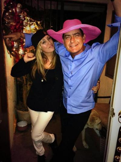 Brett Rossi posted a Twitter shot with Charlie Sheen in late 2013. They were engaged but called it quits.